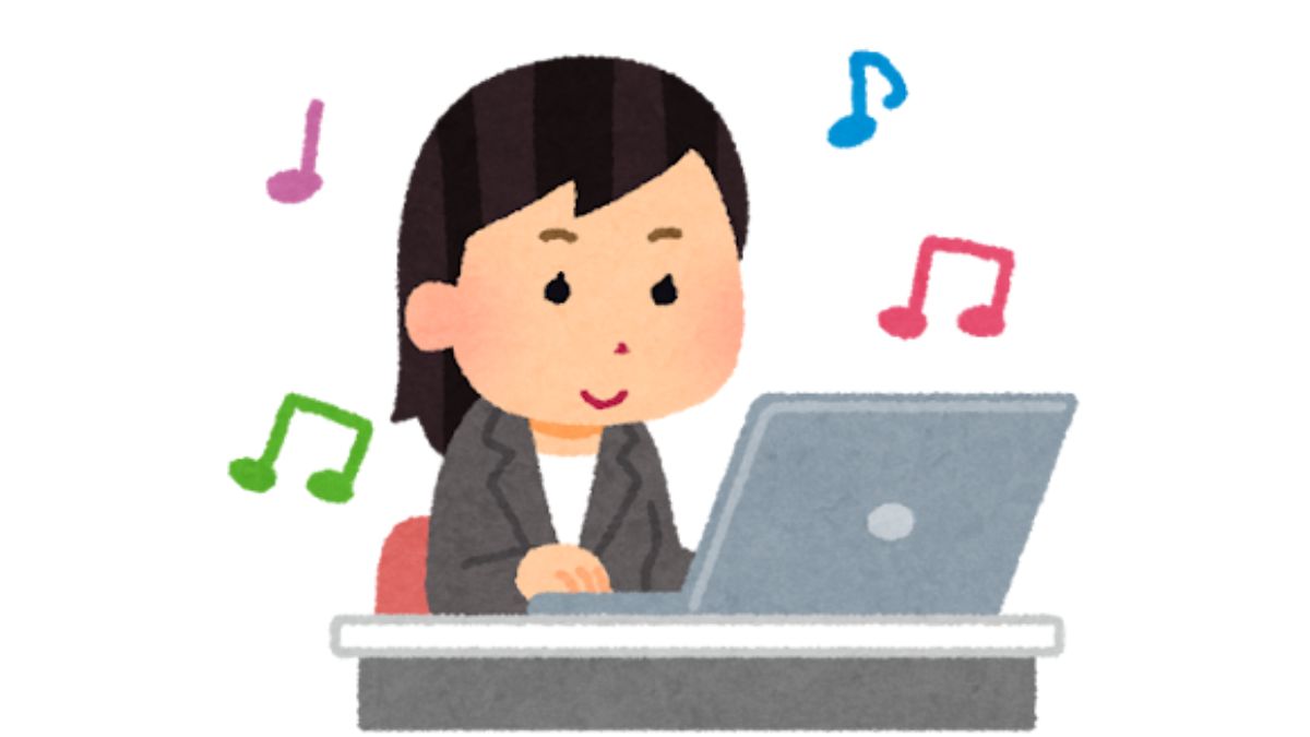 音楽を聞きながら仕事をする女性